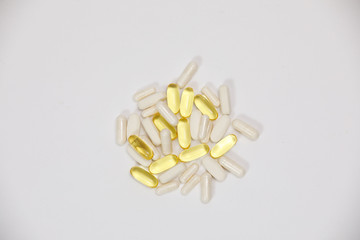 pills and vitamins on a white background