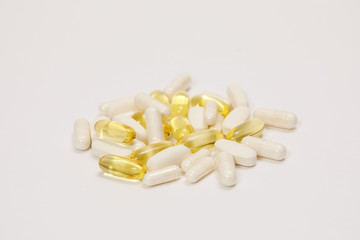 pills and vitamins on a white background