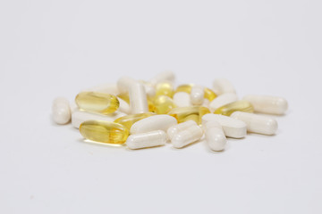 pills and vitamins on a white background