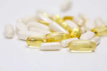 pills and vitamins on a white background