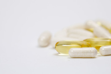 pills and vitamins on a white background