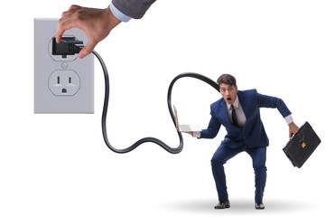 Businessman being powered by electricity and plug