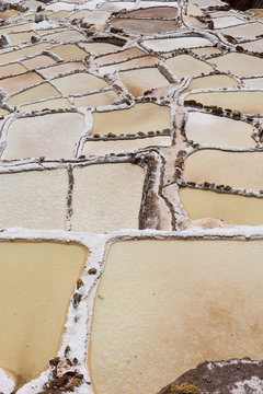Salt evaporation ponds in the town of Maras in the Sacred Valley near Cusco, Peru