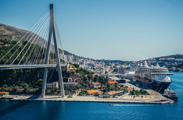Franjo Tudjman Bridge in Gruz neighborhood od Dubrovnik. Mein Sschiff 3 cruise ship on right side, Croatia