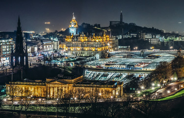 Aerial view of Edinburgh with buildings of National Gallery of Scotland and Waverley Railway Station on photo, UK