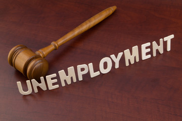 Unemployment and economics crisis concept, wooden judge gavel and word unemployment.