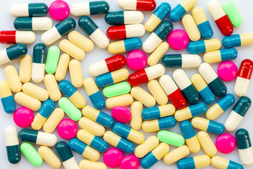 Background of colorful pills, health and medication, coronavirus, covid-19 treatment concept