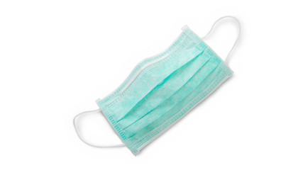 Green surgical mask as a protection from COVID-19 pandemic. Clipping path is included.