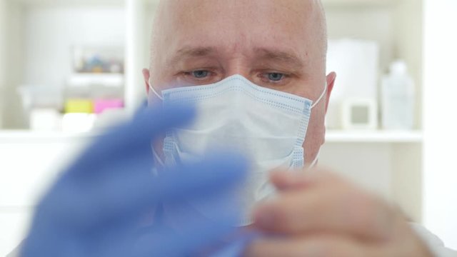 Doctor Image Wearing Protective Face Mask and Gloves, Medical Person with Protection Equipment in a Quarantined Hospital Against Virus Epidemic