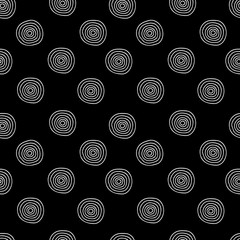 Vector seamless pattern of white hand-drawn circles isolated on a black background