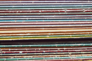 Stack of old magazines. heap of retro newspapers. vintage journals lie on top of each other. colorful background from the printed publications