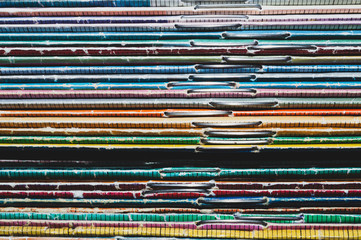 Stack of old magazines. heap of retro newspapers. vintage journals lie on top of each other. colorful background from the printed publications