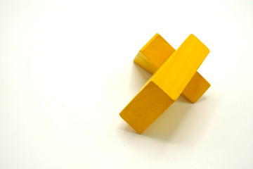 Twisted colorful building blocks made of wood. Educational toy and logical puzzle. Abstract mobile structure.