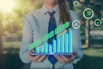 Conceptual hand writing showing Build Your Brand. Concept meaning enhancing brand equity using...