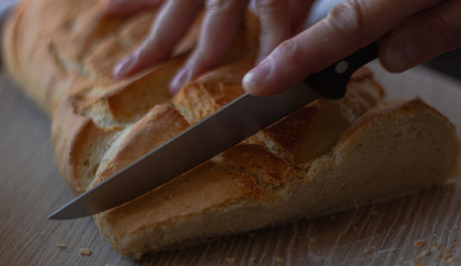 cutting freshly baked bread