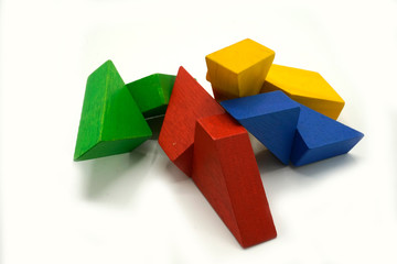 Twisted colorful building blocks made of wood. Educational toy and logical puzzle. Abstract mobile structure.