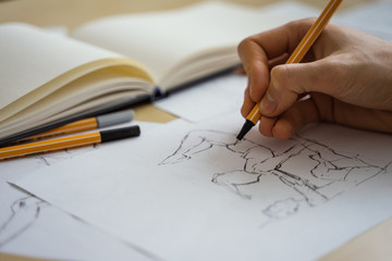 How to draw class of many figure drawing pencil and marker sketches. The artist worskspace with male and female drawings and pencils on the white paper, art, craft, creativity, inspiration, concepts