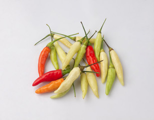 colorful of chili peppers isolated on white