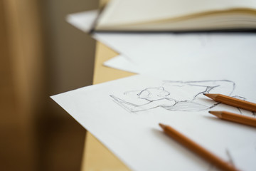 How to draw class of many figure drawing pencil and marker sketches. The artist worskspace with male and female drawings and pencils on the white paper, art, craft, creativity, inspiration, concepts