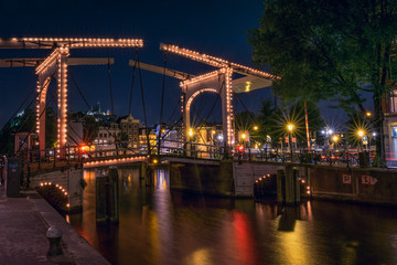 Walter Süskindbrug Bridge at night with water reflections on ca