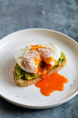 Toast with mashed avocado and poached egg