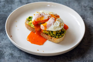 Toast with mashed avocado and poached egg