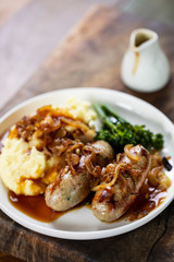 Sausages with fried onions and mashed potatoes