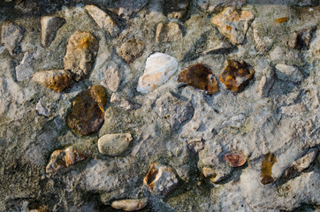 Texture of old stone photo in the sunlight