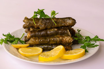 leaf wrap, vine leaf, traditional food, isolated on white, dolmades, sarmale, dolma, lemon slices, appetizer