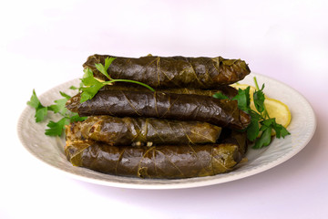leaf wrap, vine leaf, traditional food, isolated on white, dolmades, sarmale, dolma, lemon slices, appetizer