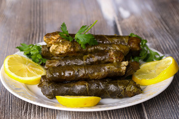 leaf wrap, vine leaf, traditional food, isolated on white, dolmades, sarmale, dolma, lemon slices, appetizer