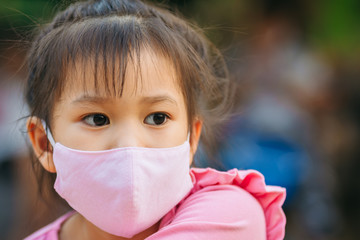 Kids wearing the mask for protect from virus and air pollution. Prevention by mask to reduce spread...