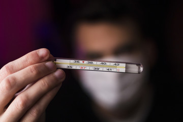 Young Man with a Thermometer