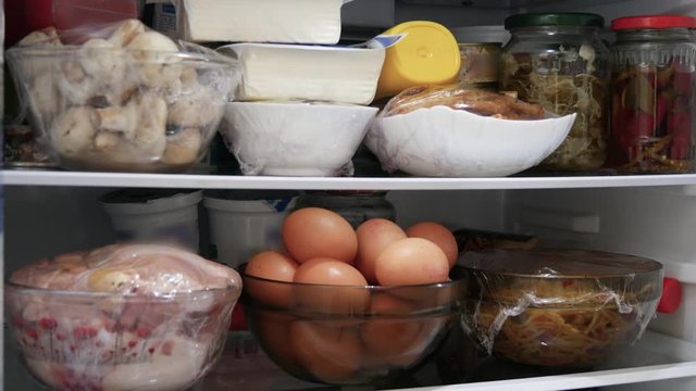 Refrigerator Filled with Prepared Food, Meat, and Vegetable,  Food Reserve Stored at a Cool Temperature
