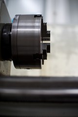 Abandoned machine metalworking lathe in a factory closing due to the pandemic virus