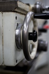 Abandoned machine metalworking lathe in a factory closing due to the pandemic virus