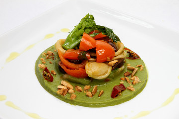 Orecchiette with red yellow tomato, leccine olives and escarole on turnip cream and toasted almonds