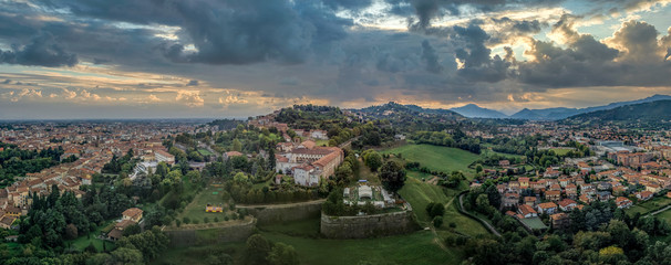 Stormy clouds brewing over the medieval walled city center of Bergamo, Lombardy Italy with views of the Venetian angled bastions