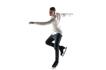 Man figure skating isolated on white studio backgound with copyspace. Professional practicing and...