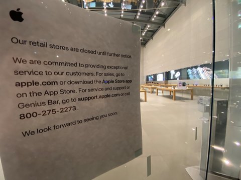 NEW YORK CITY - March 27, 2020: Coronavirus Covid-19 Apple Store sign in Manhattan says store is closed as economy falls into recession and Apple Inc. close. NASDAQ: AAPL