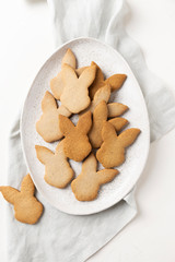 Easter cookies on white concrete background. Top view.