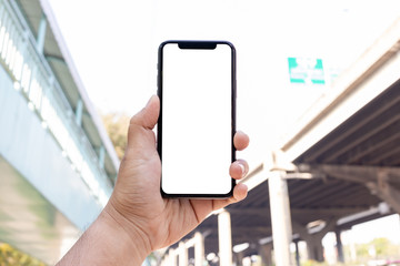 Asian man holding phone mock up center frame show application transportation take to destination isolated display for insert screen