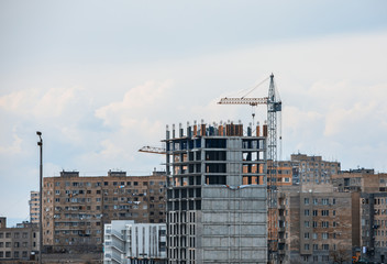crane against a new block of flats