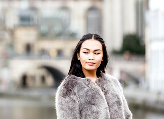 Beautiful portrait of fashionable asian woman in winter clothes 