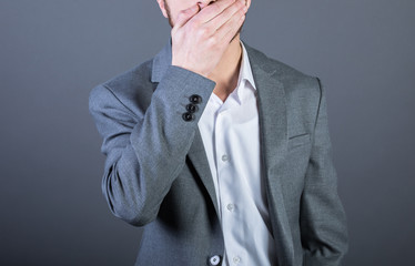 man closed mouth by hand