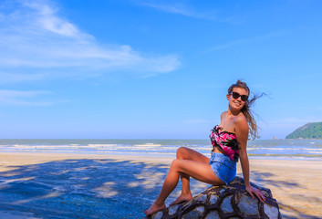 Young woman enjoying on the beach