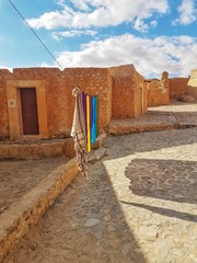 Obraz premium Drying laundry on a string. Stylish houses and hanging laundry