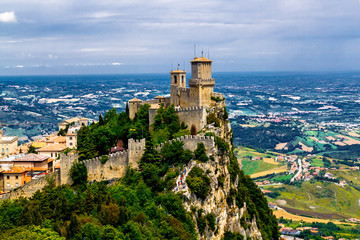 Naklejka premium Republic San Marino Prima Torre Guaita first fortress tower with brick walls on Mount Titano stone rock.