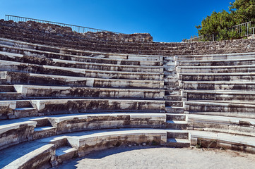 Fragment of stone ruins of the ancient theater in Kos in Greece.