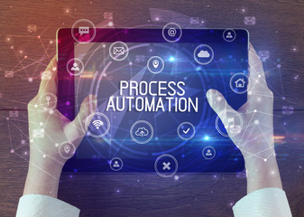 Close-up of a tablet with PROCESS AUTOMATION inscription, innovative technology concept